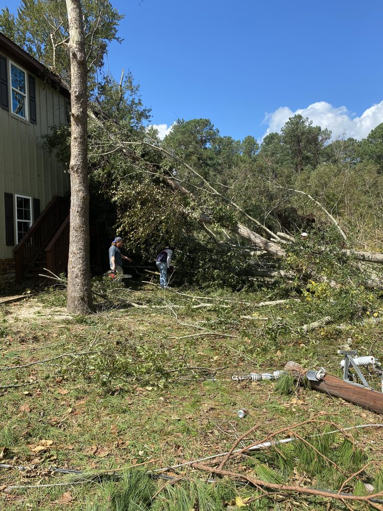 Storm damage and fallen tree cleanup crew on site